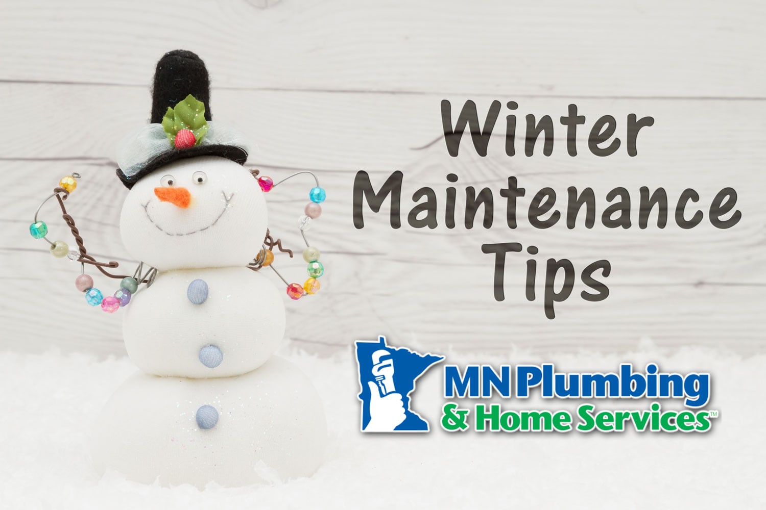Snowman decorated with MN Plumbing and Home Services logo