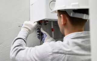 who do you call to fix a hot water heater