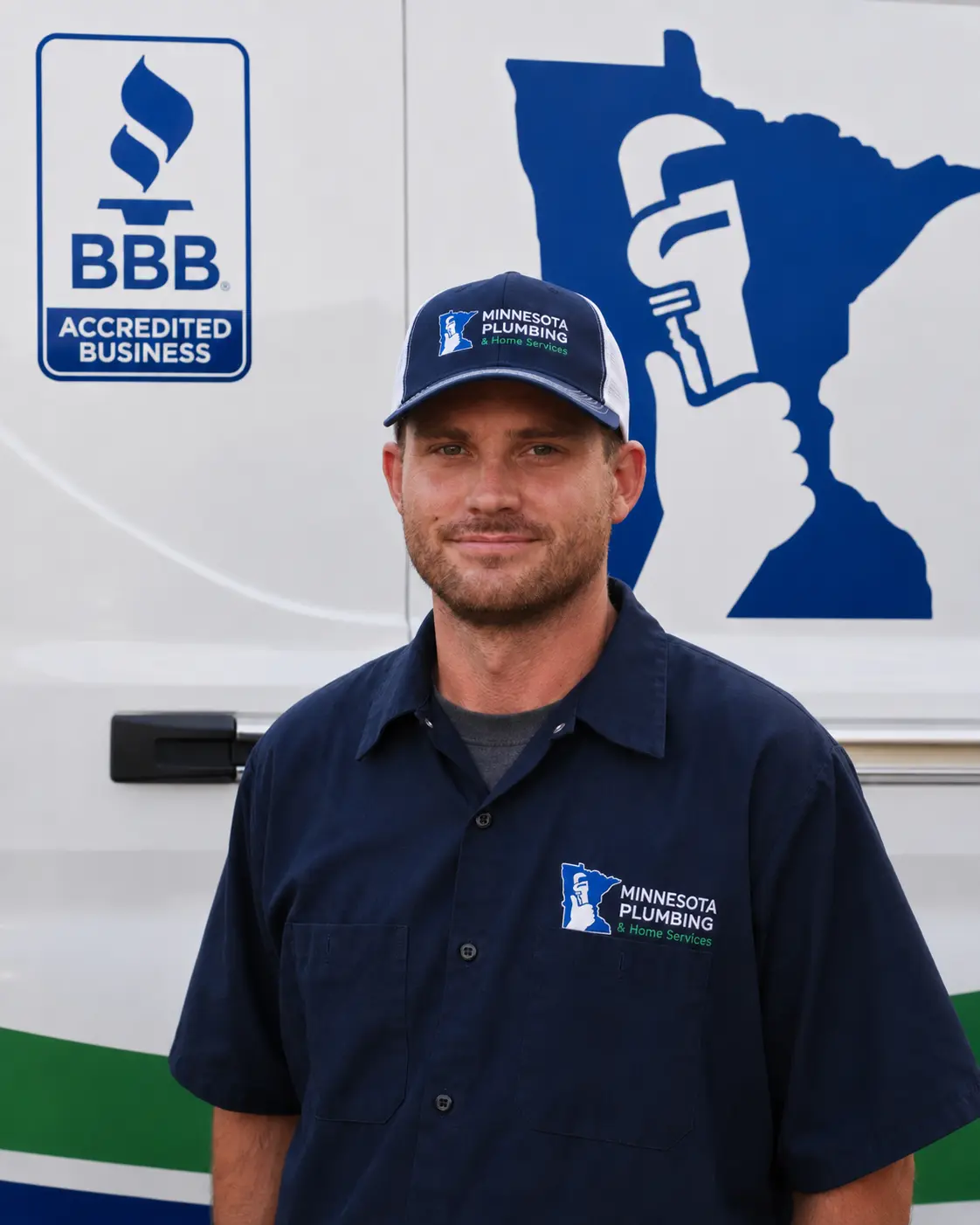 Jesse | MN Plumbing & Home Services Technician Jesse of MN Plumbing & Home Services standing in front of a company service van at the Lakeville, MN headquarters.
